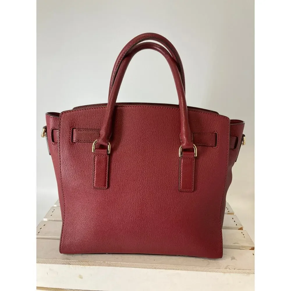 MICHAEL KORS, LARGE WINE LEATHER HANDBAG WITH LOCK CHARM.